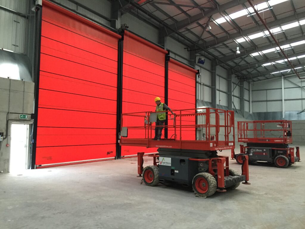 Wind resistant industrial doors